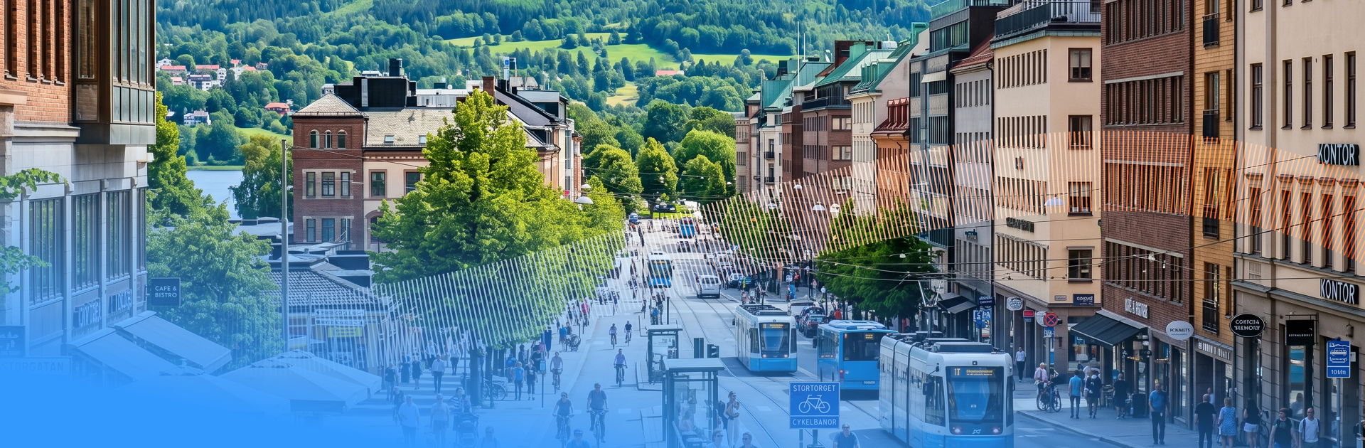 Lively pedestrian shopping street lined with shops, with a tram and people walking