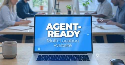Agent-ready multi-location website concept on a laptop screen in a modern office
